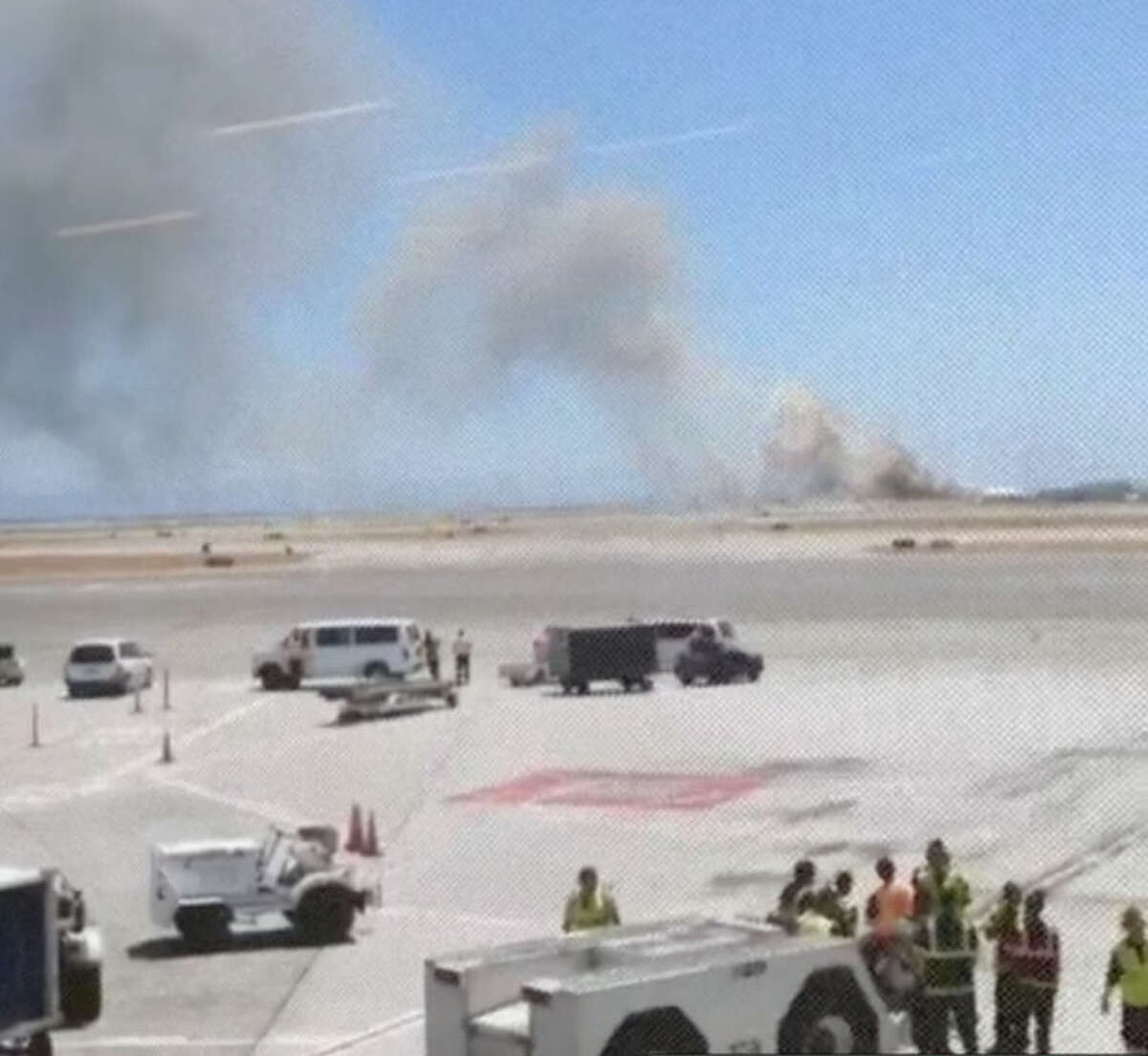 This photo provided by Wei Yeh shows what a federal aviation official says was an Asiana Airlines flight crashing while landing at San Francisco airport on Saturday, July 6, 2013. It was not immediately known whether there were any injuries. (AP Photo/Wei Yeh)