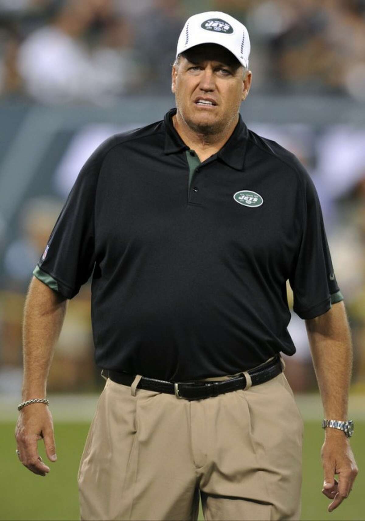 FILE - In this Aug. 26, 2012, file photo, New York Jets head coach Rex Ryan walks on the field before a preseason NFL football game against the Carolina Panthers in East Rutherford, N.J. The Jets' defense, featuring an improved secondary, is shaping up to be one of the toughest in the league but is being overshadowed by a quarterback controversy and the offense's inability to get into the end zone. The Jets are scheduled to begin their regular season on Sept. 9 at home against the Buffalo Bills. (AP Photo/Bill Kostroun, File)
