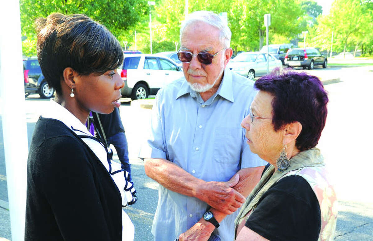 Norwalk Democratic Chair Amanda Brown meets with former Norwalk Councilman William Krummel and his wife Regina Sunday at Norwalk City Hall for a press conference on the incident that occured between the three of them last week. Hour photo/Matthew Vinci