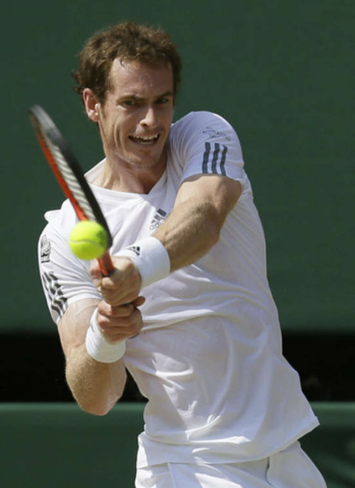 Andy Murray of Britain returns to Novak Djokovic of Serbia during the Men's singles final match at the All England Lawn Tennis Championships in Wimbledon, London, Sunday, July 7, 2013. (AP Photo/Alastair Grant)