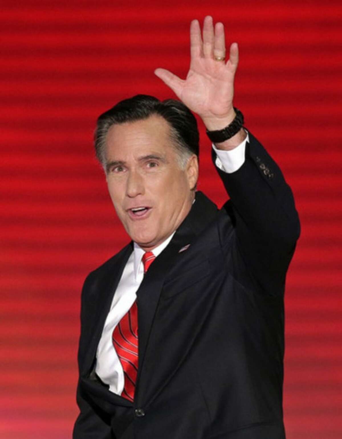 Republican presidential nominee Mitt Romney waves to the delegates as he walks to the stage during the Republican National Convention in Tampa, Fla., on Thursday, Aug. 30, 2012. (AP Photo/J. Scott Applewhite)
