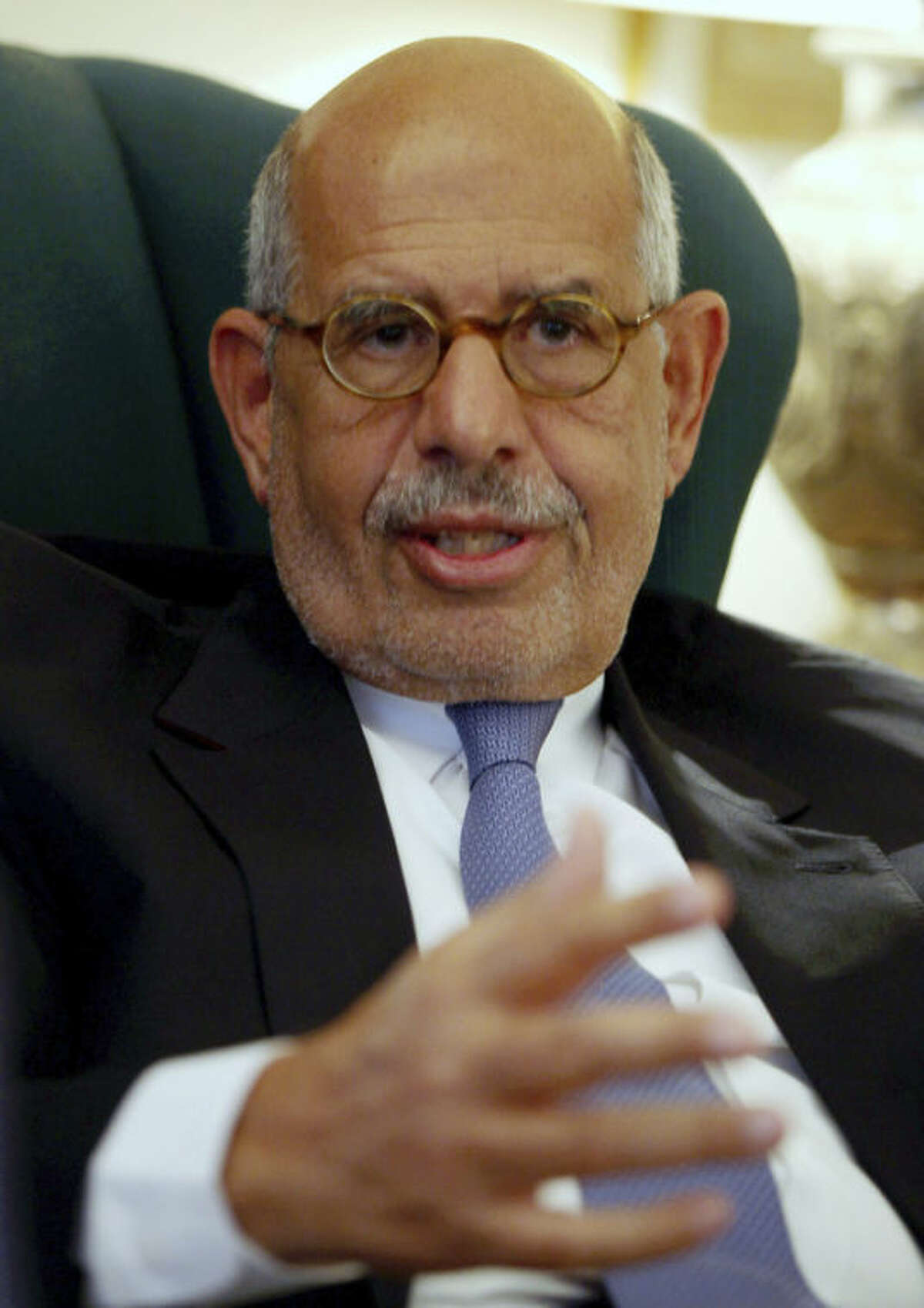 FILE - In this Tuesday, April 30, 2013, file photo, Egypt's leading opposition leader Mohamed ElBaradei speaks to a small group of journalists including The Associated Press at his house on the outskirts of Cairo, Egypt. An opposition spokesman says pro-reform leader Mohamed ElBaradei has been named interim prime minister. Khaled Dawoud of the National Salvation Front, the main opposition grouping, told The Associated Press that interim President Adly Mansour will swear in ElBaradei on Saturday evening.(AP Photo/Khalil Hamra, File)
