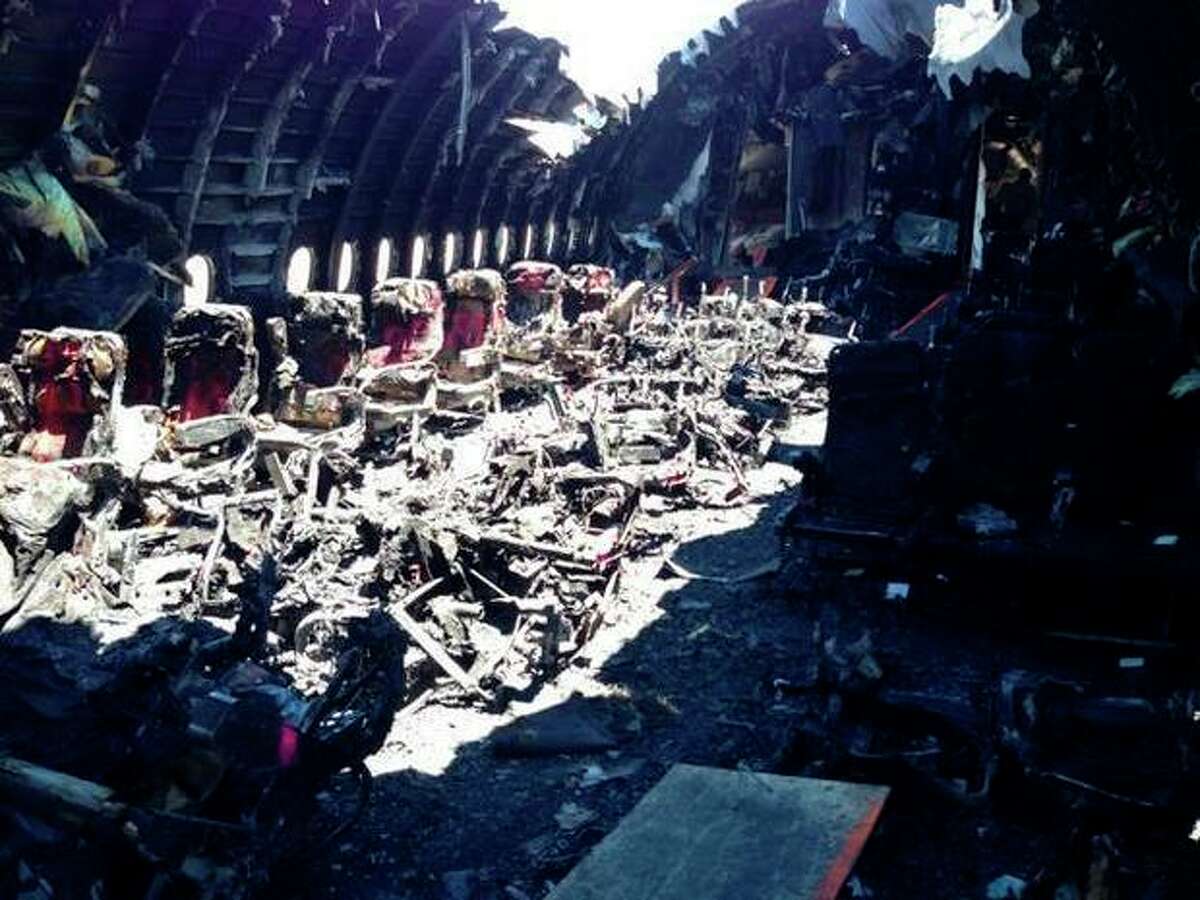 This image released by the National Transportation Safety Board, on Thursday, July 11, 2013, shows the charred remains of Asiana Airlines Flight 214 in San Francisco. The Asiana flight crashed upon landing Saturday, July 6, at San Francisco International Airport, and two of the 307 passengers aboard were killed. (AP Photo/NTSB)