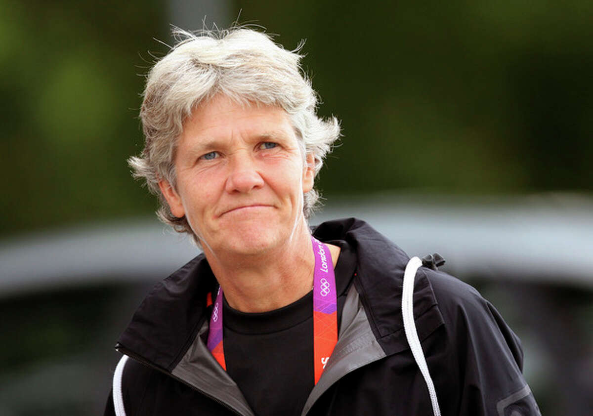 FILE - This Aug. 2, 2012 file photo shows U.S. women's soccer head coach Pia Sundhage arriving at a soccer practice for the 2012 London Summer Olympics at Cochrane Park in Newcastle, England. After leading the team to two Olympic gold medals and its first spot in a World Cup final in more than a decade, Sundhage is stepping down. Saturday's announcement of Sundhage's departure came just a few hours before the Americans kicked off their "victory tour" to celebrate their gold medal at the London Olympics, where the Americans beat Japan 2-1 in a rematch of last year's World Cup final. The search for a new coach will begin immediately. (AP Photo/Scott Heppell, File)