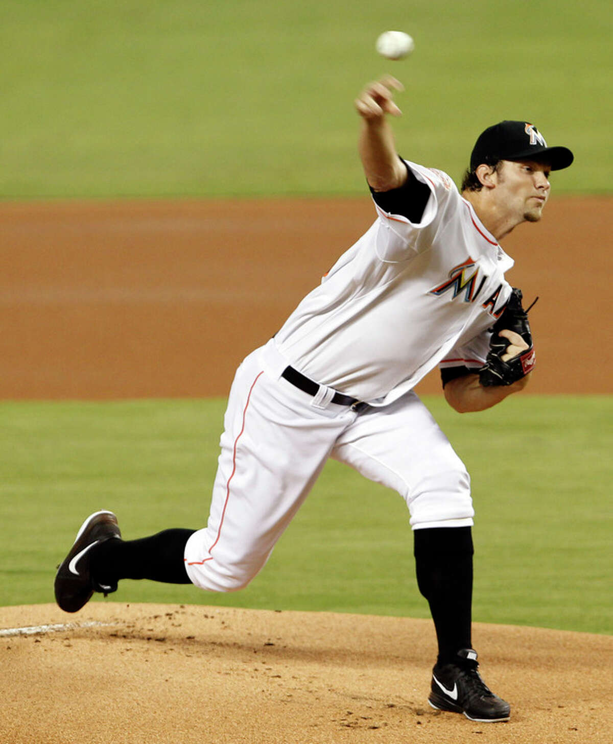 Miami Marlins' Josh Johnson pitches against the New York Mets in the first inning of a baseball game in Miami, Saturday, Sept. 1, 2012. (AP Photo/Alan Diaz)