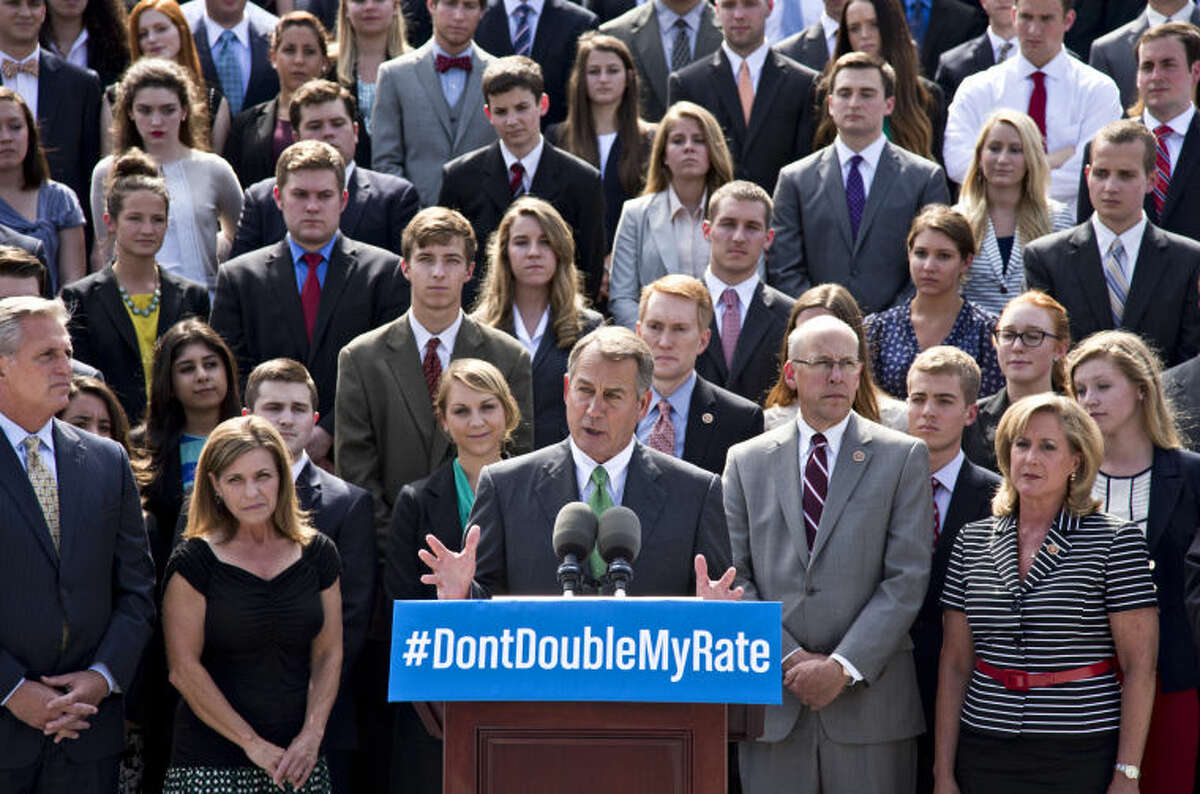 In this July 8, 2013, photo, with a backdrop of college students on the step of the House of Representatives, Speaker of the House John Boehner, R-Ohio, center, and GOP leaders talk about the politics of federal student loan rates which doubled on July 1, at the Capitol in Washington. Senate Democrats are trying to restore lower interest rates on student loans. A procedural vote is scheduled for Wednesday on a Senate measure that would return rates on subsidized Stafford loans to 3.4 percent for one year. An earlier attempt in the Senate to keep rates low came up short and those loans’ rates doubled to 6.8 percent on July 1. (AP Photo/J. Scott Applewhite)