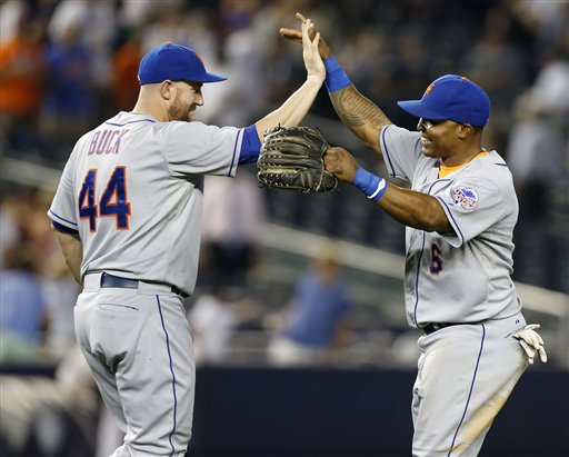 New York Mets' Anthony Recker, left, celebrates with Marlon Byrd