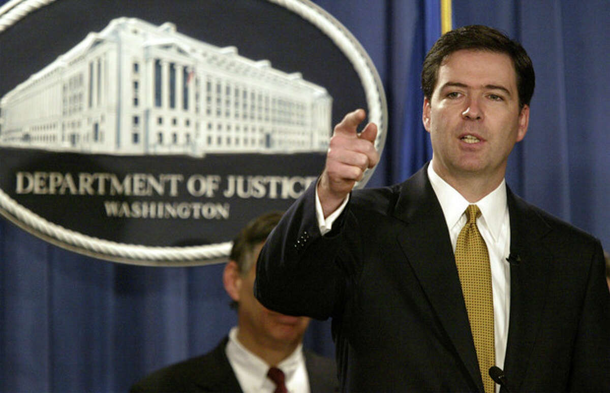 FILE - In this Jan. 14, 2004 file photo, Deputy Attorney General James Comey gestures during a news conference in Washington. President Barack Obama is preparing to nominate former Bush administration official James Comey to head the FBI, people familiar with the decision said Wednesday, May 29, 2013. (AP Photo/Evan Vucci, File)