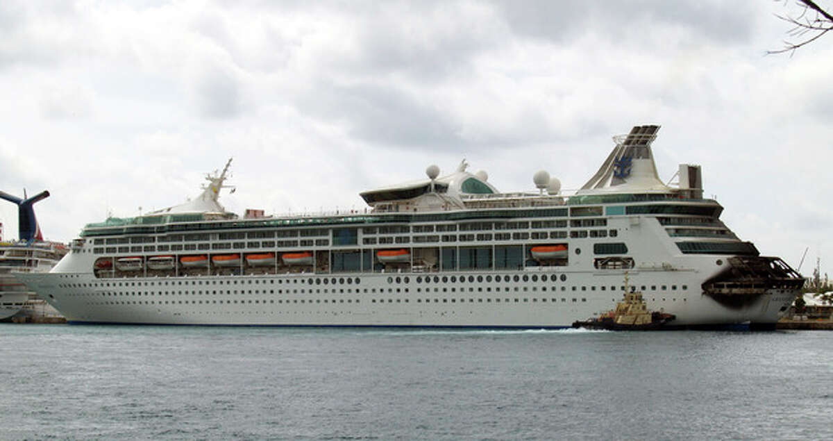 The fire-damaged rear of Royal Caribbean's Grandeur of the Seas cruise ship is seen while docked in Freeport, Grand Bahama island, Monday, May 27, 2013. Royal Caribbean said the fire occurred early Monday while on route from Baltimore to the Bahamas on the mooring area of deck 3 and was quickly extinguished. All 2,224 guests and 796 crew were safe and accounted for. (AP Photo/The Freeport News, Jenneva Russell)