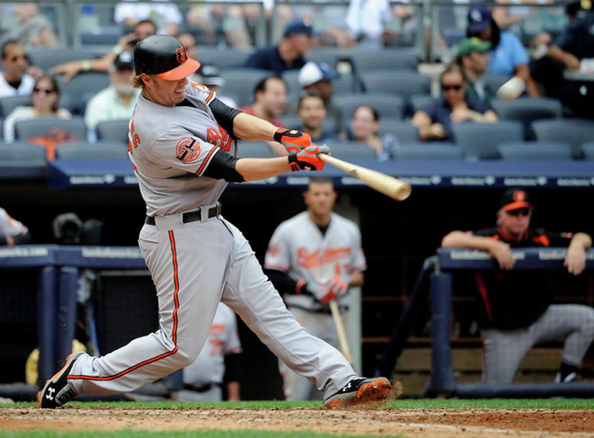 Baltimore Orioles' Mark Reynolds hits a three-run home run off New York Yankees starting pitcher Phil Hughes in the sixth inning of a baseball game on Sunday, Sept. 2, 2012, at Yankee Stadium in New York. (AP Photo/Kathy Kmonicek)