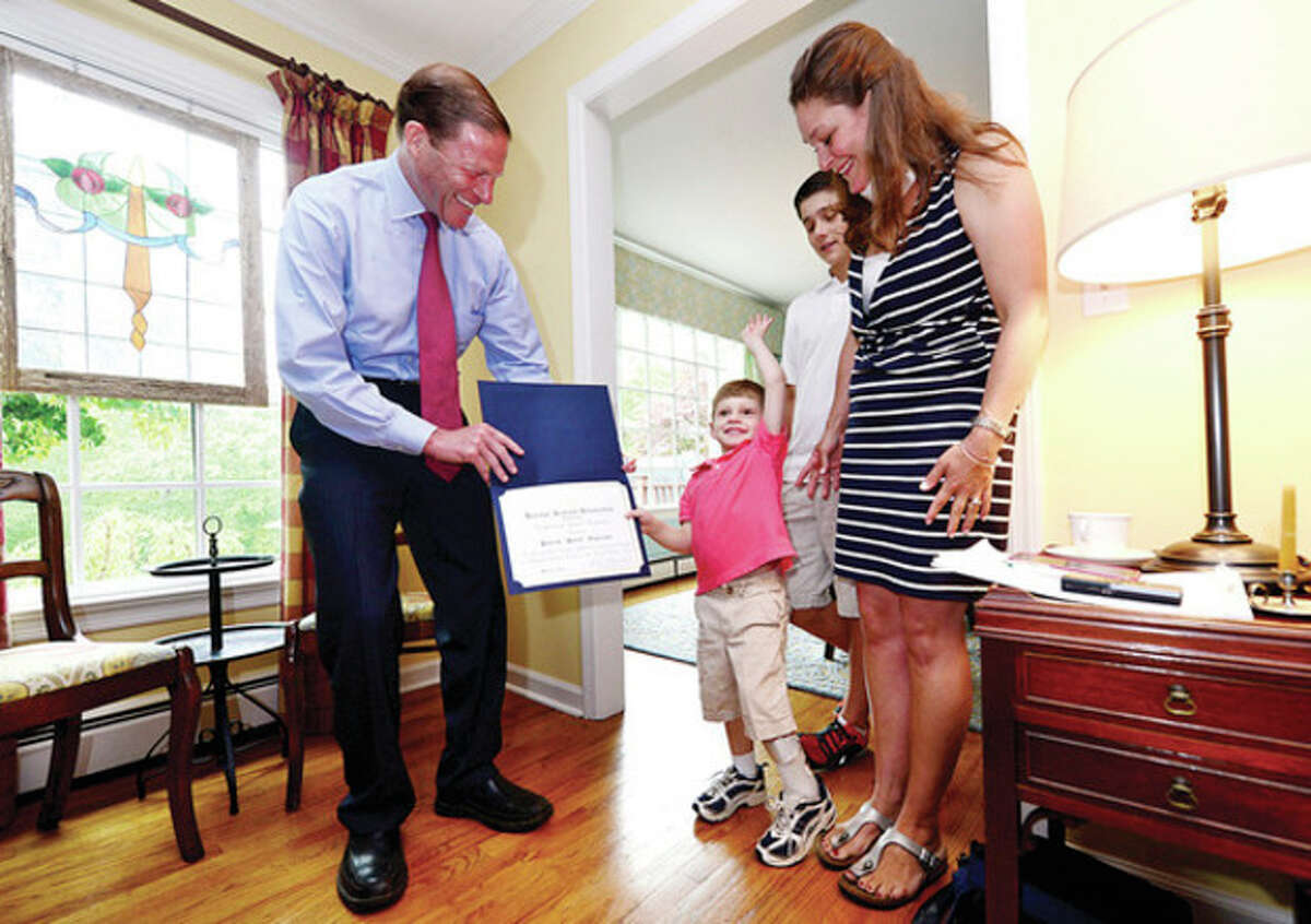 Hour photo / Erik Trautmann U.S. Sen. Richard Blumenthal, D-Conn., visits 5-year-old Patrick "Patch" Angerame, who suffered a stroke before he was born, and the Angerame family, including parent Jennifer and brother Michael Angerame, 11, at their home to advocate for pediatric stroke awareness.