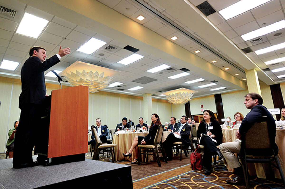US Senator Chris Murphy addresses members of the Stamford Chamber of Commerce during the groups monthy luncheon Wednesday at the Sheraton. Hour photo / Erik Trautmann