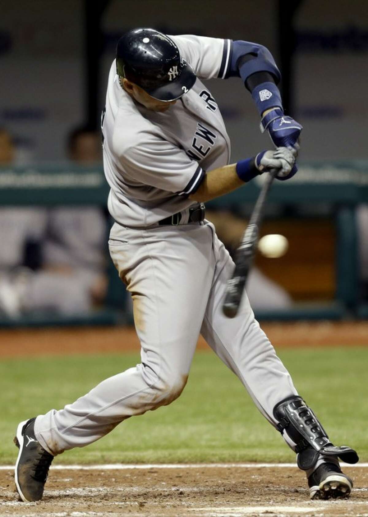 New York Yankees' Derek Jeter hits a seventh-inning fielder's choice off Tampa Bay Rays relief pitcher Kyle Farnsworth during a baseball game, Wednesday, Sept. 5, 2012, in St. Petersburg, Fla. Two runs scored on a throwing error by Rays' Elliot Johnson. (AP Photo/Chris O'Meara)