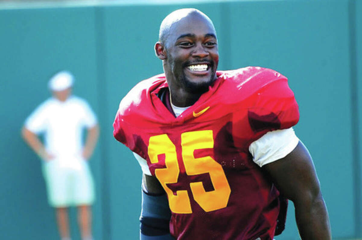 USC photo USC running back Silas Redd is all smiles at a recent Trojans' practice. The Norwalk resident is coming East this weekend, when USC takes on Syracuse Saturday afternoon at MetLife Stadium in New Jersey.