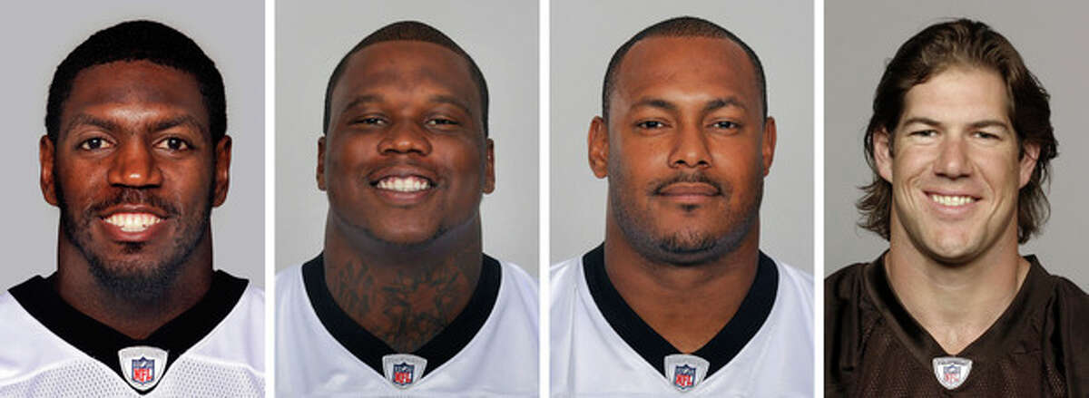 FILE - From left are NFL football players Jonathan Vilma, in 2011; Anthony Hargrove, in 2010; Will Smith, in 2011; and Scott Fujita, in 2011. The suspensions of four players in the NFL's bounty investigation have been lifted by a three-member appeals panel. The league reinstated those players a few minutes after Friday's, Sept. 7, 2012 ruling. While the ruling allows Saints linebacker Jonathan Vilma, Saints defensive end Will Smith, Cleveland linebacker Scott Fujita and free agent defensive lineman Anthony Hargrove to play immediately, it does not permanently void their suspensions (AP Photo/File)