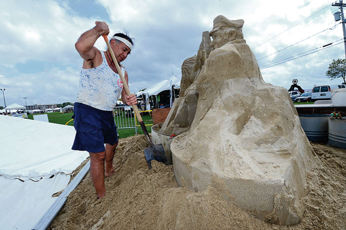 Alan Matsumoto builds a sand sculpture during the Norwalk Seaport Association 2012 Oyster Festival at Veteran's Memorial Park in Norwalk Saturday. Hour photo / Erik Trautmann