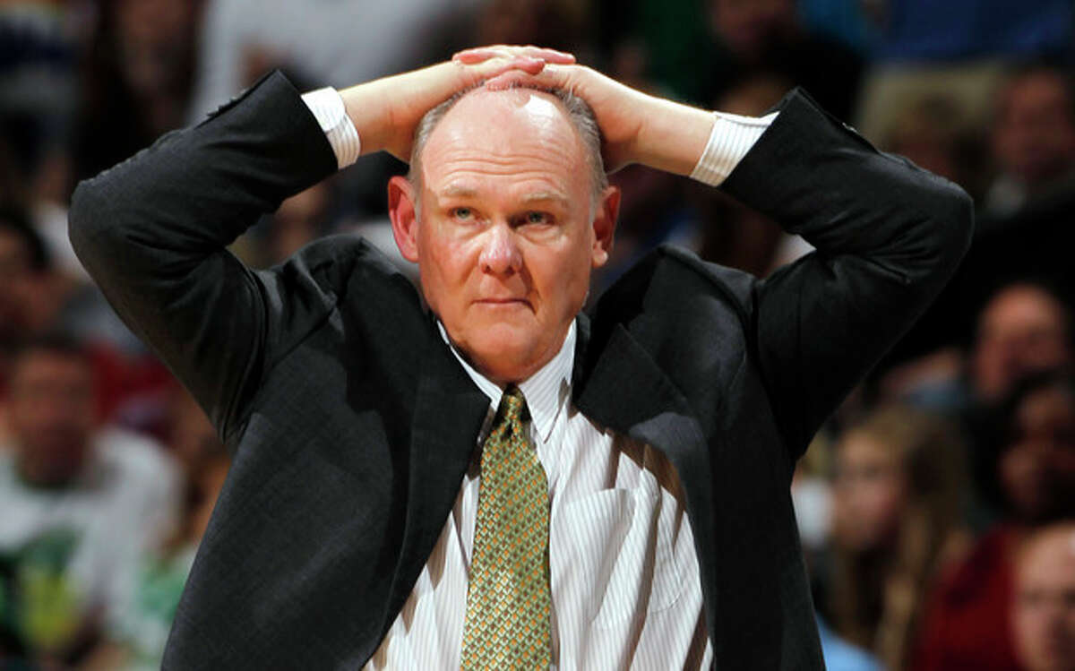 FILE - In this March 17, 2012 file photo, Denver Nuggets coach George Karl puts his hands on his head during an NBA game against the Boston Celtics in Denver. Karl is out as coach of the Nuggets. Team President Josh Kroenke confirmed in an email to The Associated Press on Thursday, June 6, 2013 that Karl's tenure was over just weeks after he was named the NBA's coach of the year. (AP Photo/David Zalubowsk, Filei)