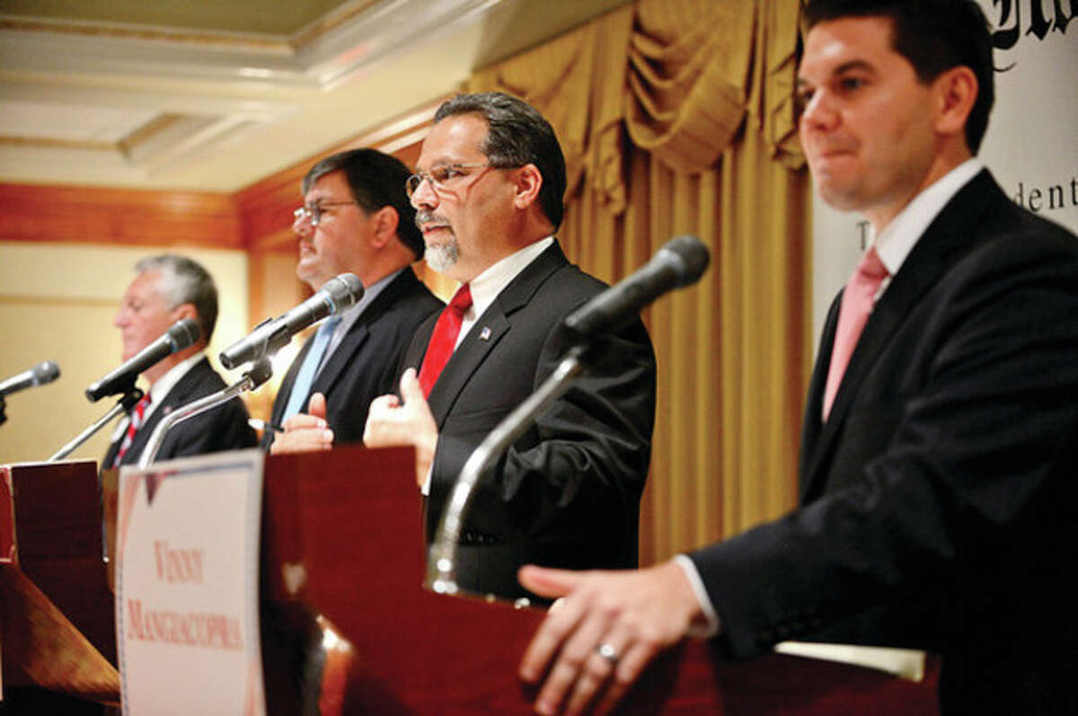 The four democratic candidates for mayor of Norwalk, Harry Rilling, Matt Miklave, Andy Garfunkel and Vinny Mangiacopra, debate Friday morning at the Norwalk Inn in an event sponsored by The Hour. Hour photo / Erik Trautmann