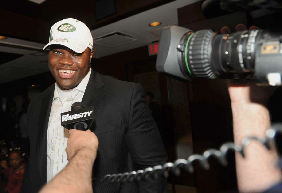 Vlad Ducasse takes questions from the media after learning he will be joining the New York Jets, during the NFL draft pick gathering at Morton's Steakhouse in downtown Stamford, Conn. on Friday April 23, 2010.