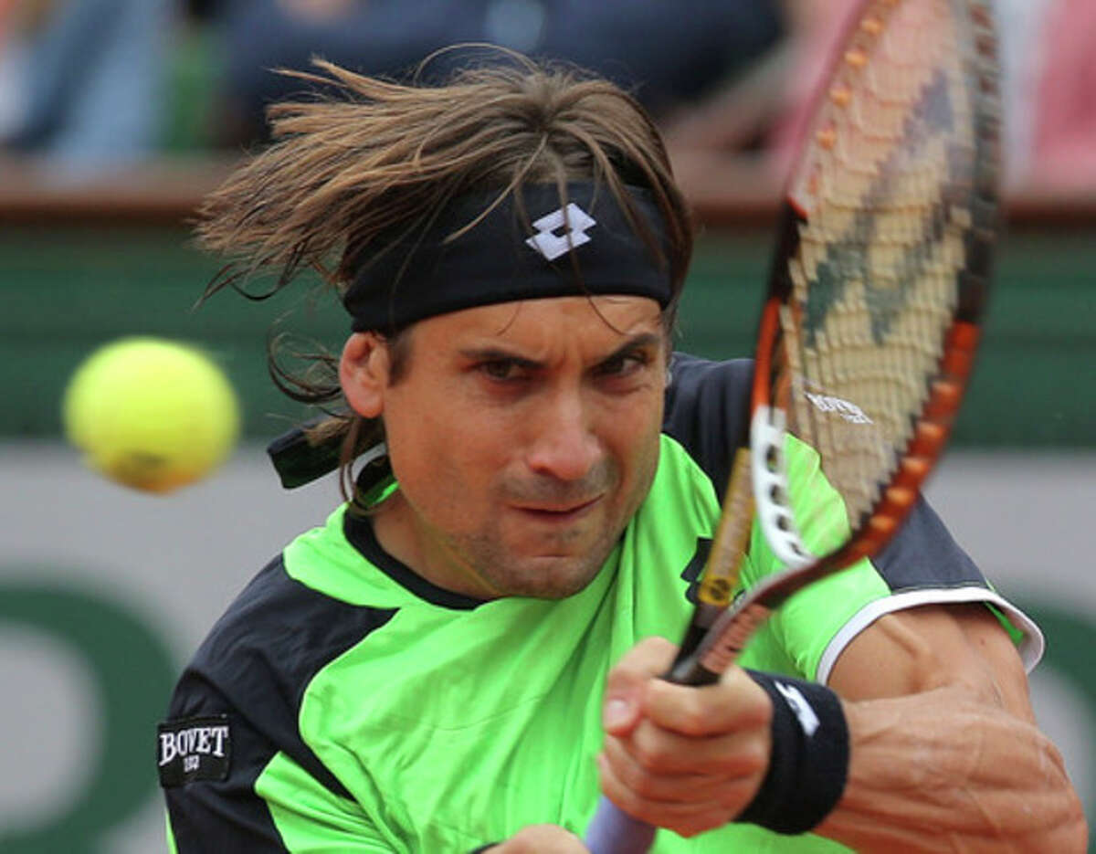 Spain's David Ferrer returns the ball to compatriot Rafael Nadal during the men's final match of the French Open tennis tournament at the Roland Garros stadium Sunday, June 9, 2013 in Paris. (AP Photo/Michel Euler)