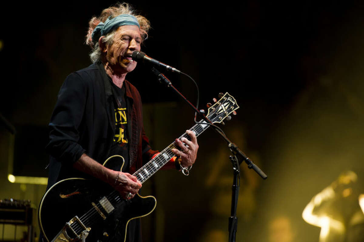 FILE - This April 13, 2013 file photo shows Keith Richards performing at Eric Clapton's Crossroads Guitar Festival 2013 at Madison Square Garden in New York. Keith Richards says he doesn't own an iPod.The 69-year-old believes music lovers are ?’all being short-changed?“ with the sound that comes out of an iPod, launched in 2001. The Rolling Stones' ?’50 & Counting Tour?“ kicks off Friday in Los Angeles. (Photo by Charles Sykes/Invision/AP, file)
