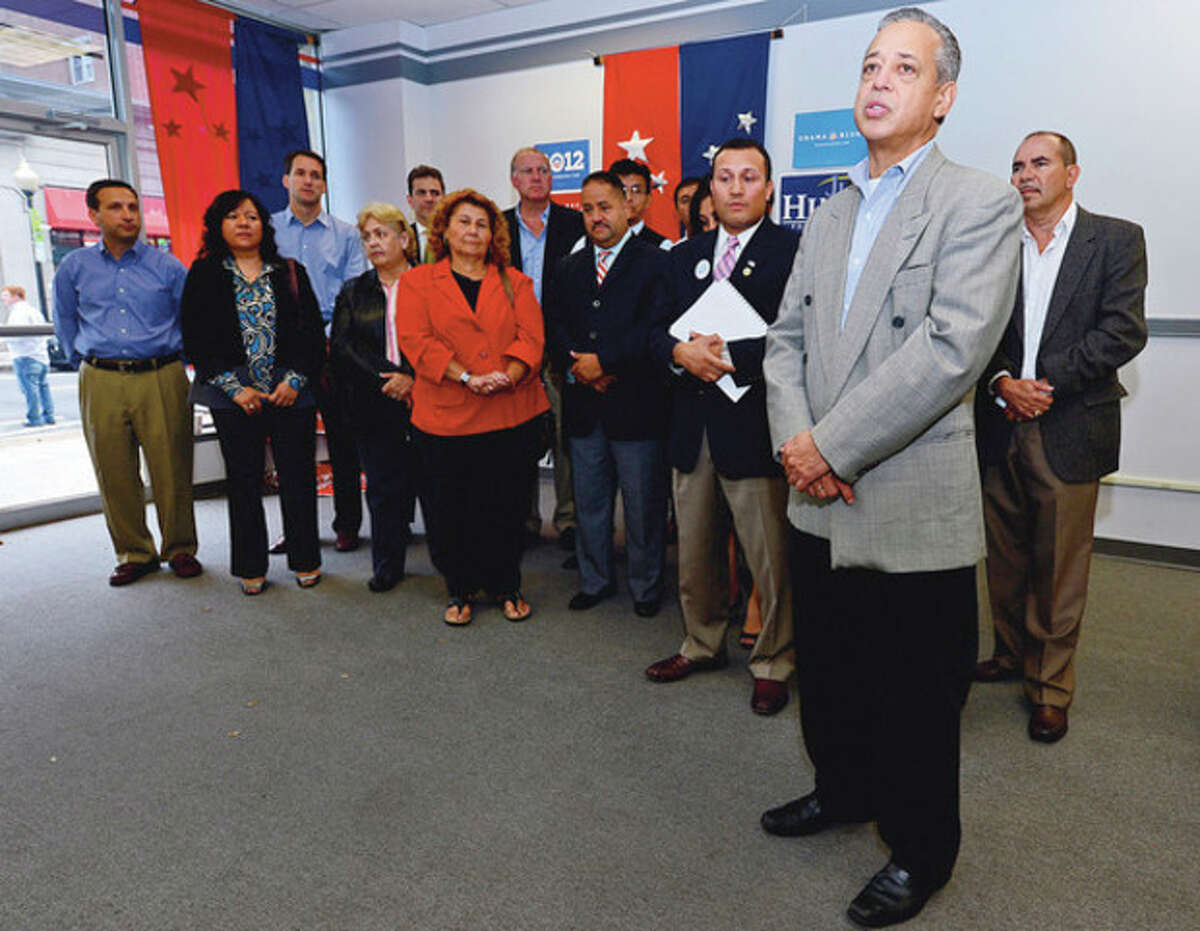 Hispanic Democrats, from Bridgeport to Stamford, and Hartford mayor Pedro Segarra rally at democratic headquarters at 20 North Main St. in support of Democratic candidates like Congressman Jim Himes and Chris Murphy. Hour photo / Erik Trautmann
