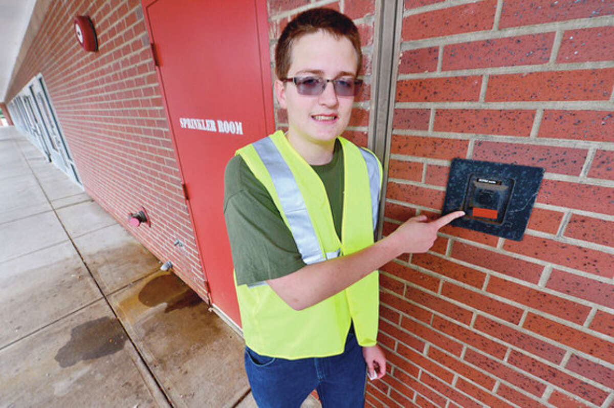 Hour photo / Erik Trautmann Zach Rilling is going for his eagle scout badge with a project designed to highlight keyboxes for the fire department.