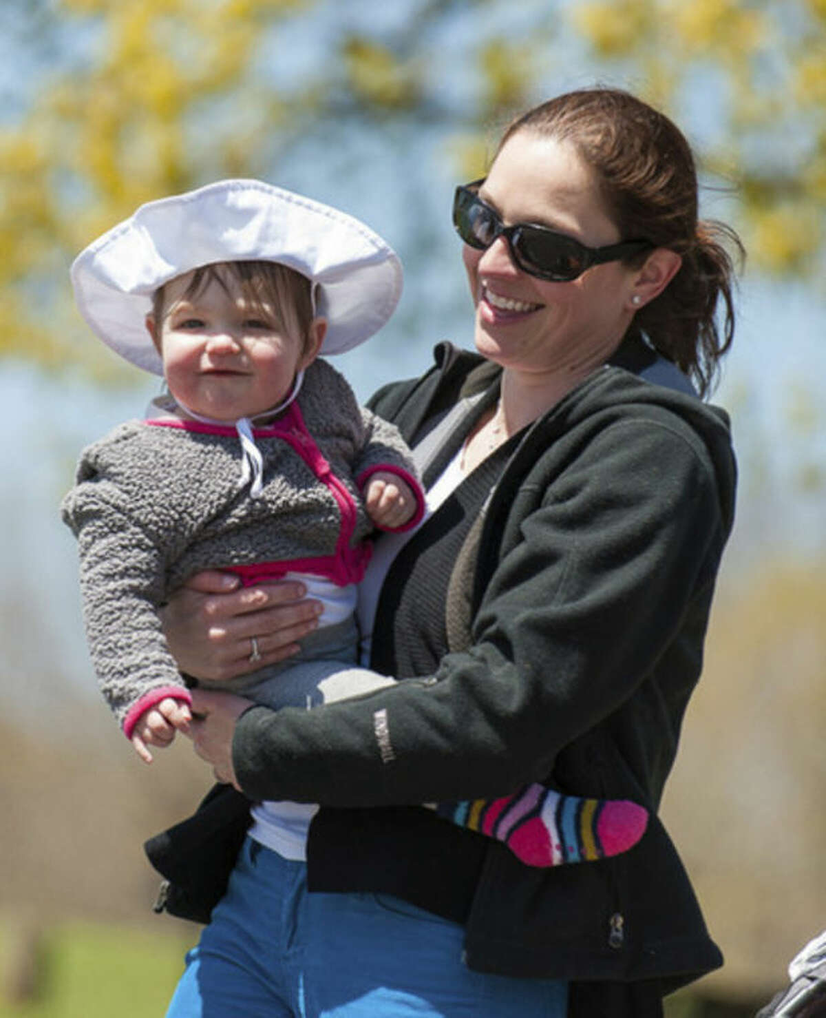 Juliana Oyola of Norwalk walks with her daughter at the STAR Walk, Roll and Stroll.