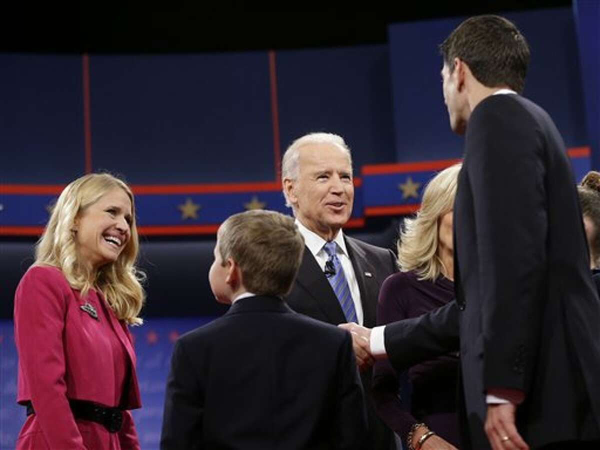 Janna Ryan, wife of Republican vice presidential nominee Rep. Paul Ryan, of  Wisconsin, right, gets a kiss from Vice President Joe Biden following the  vice presidential debate at Centre College, Thursday, Oct. 11, 2012, in  Danville, Ky. (AP Photo/Eric 