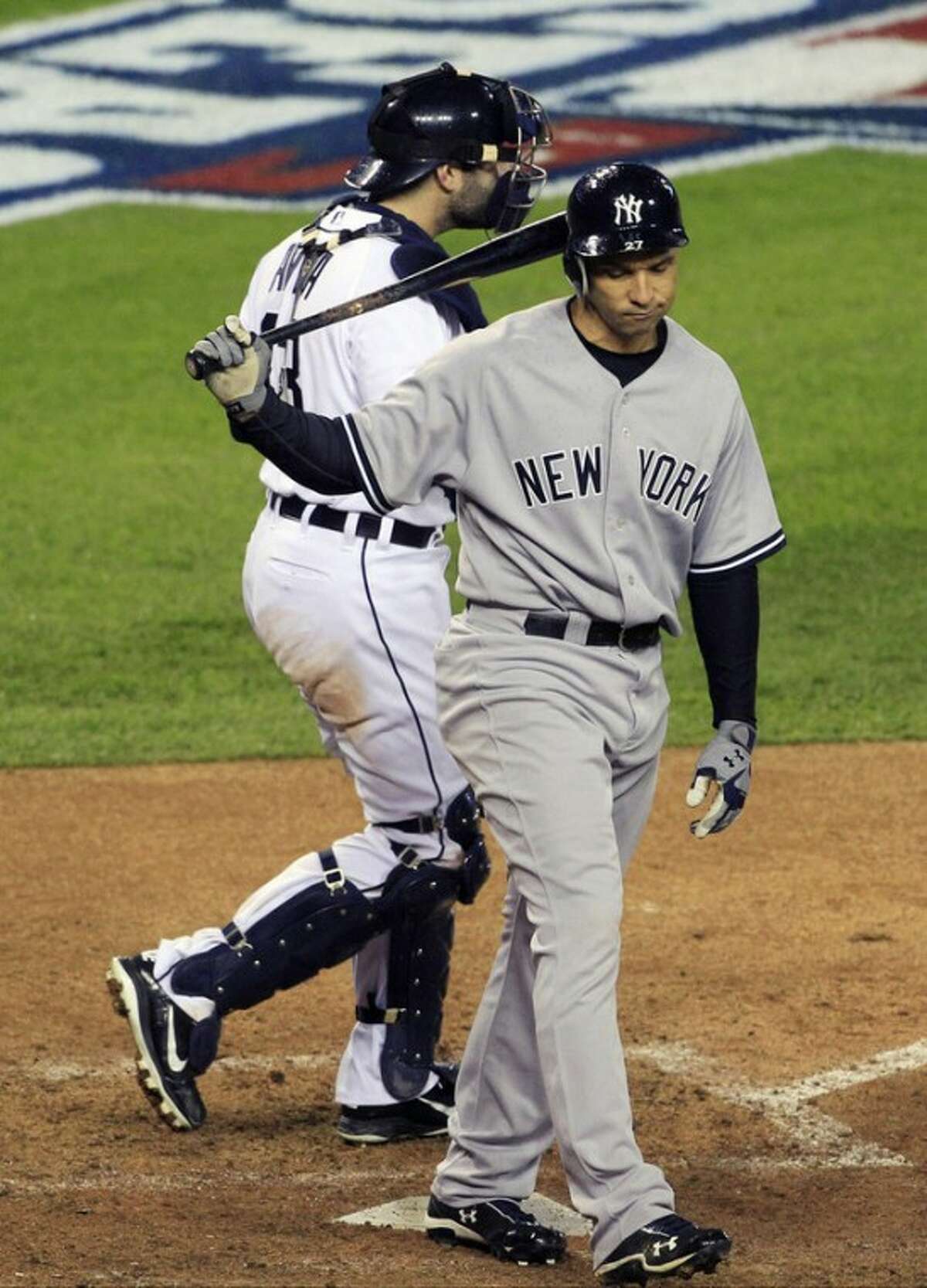 New York Yankees' Raul Ibanez reacts after striking out ending the game as Detroit Tigers' Alex Avila leaves home plate at Game 3 of the American League championship series Tuesday, Oct. 16, 2012, in Detroit. (AP Photo/Carlos Osorio)
