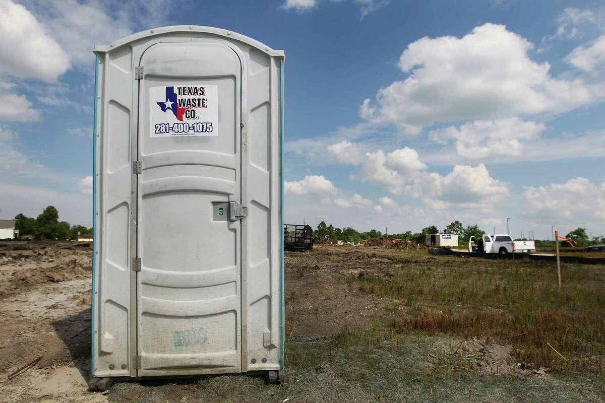 A portable toilet at Massey Lakes Blvd and Lake View Terrace Dr. photographed Wednesday, June 8, 2016, in Pearland. There is a trademark dispute between two portable toilet companies. Texas Outhouse claims that Texas Waste Co. (which is owned by Fresh Can) has stolen its "famous" logo of Texas and the Texas star and is trying to confusing the toilet buying public. ( Steve Gonzales / Houston Chronicle )