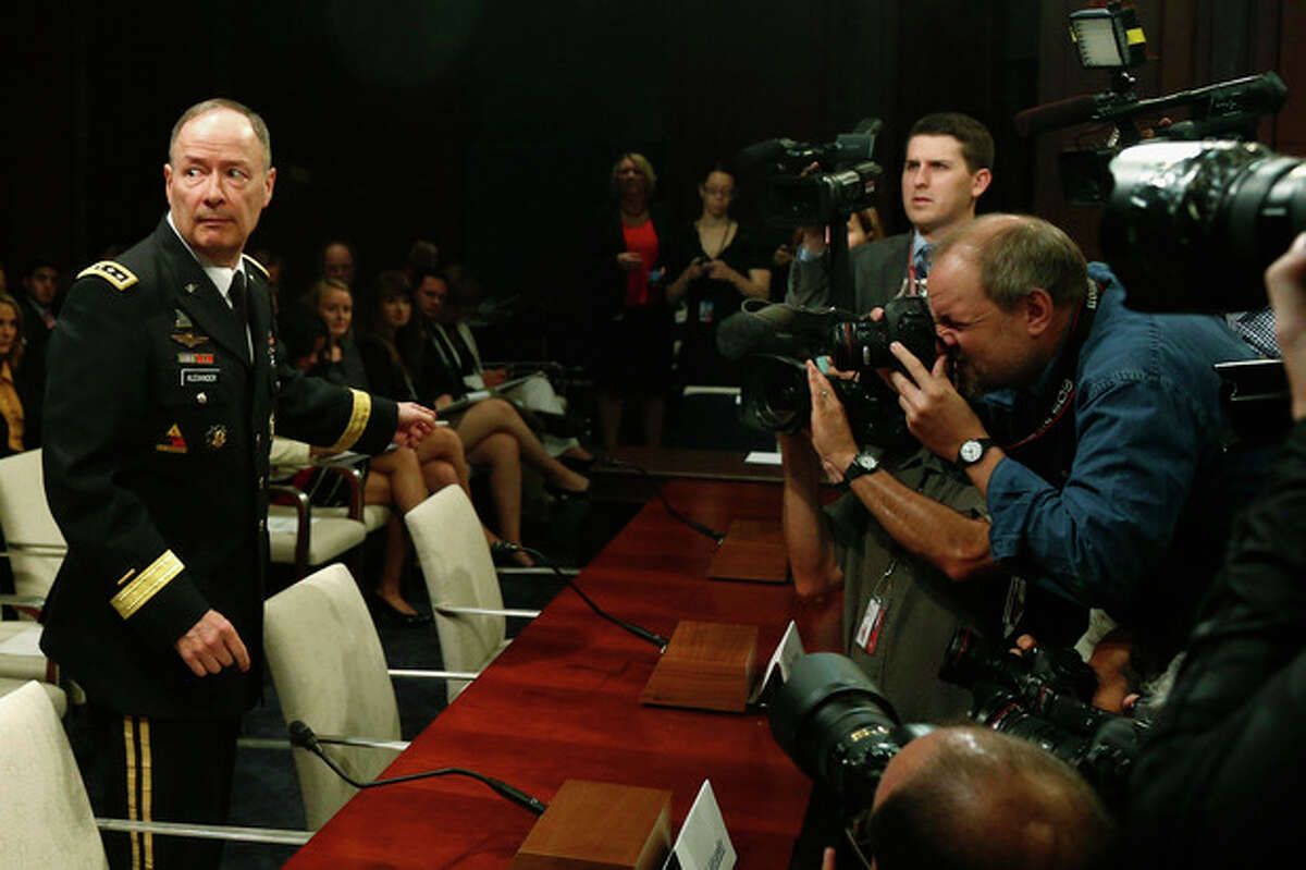 National Security Agency (NSA) Director Gen. Keith B. Alexander approaches the witness table on Capitol Hill in Washington, Tuesday, June 18, 2013, to testify before the House Intelligence Committee hearing regarding NSA surveillance. (AP Photo/Charles Dharapak)