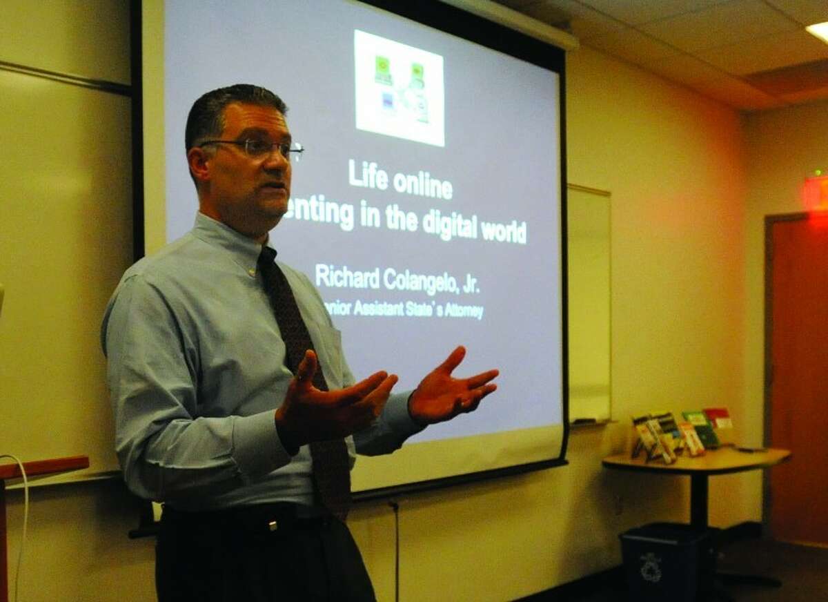Senior Assistant State's Attorney Richard Colangelo speaks Tuesday at the Wilton Library at the Internet Safety Seminar for parents of young children. 