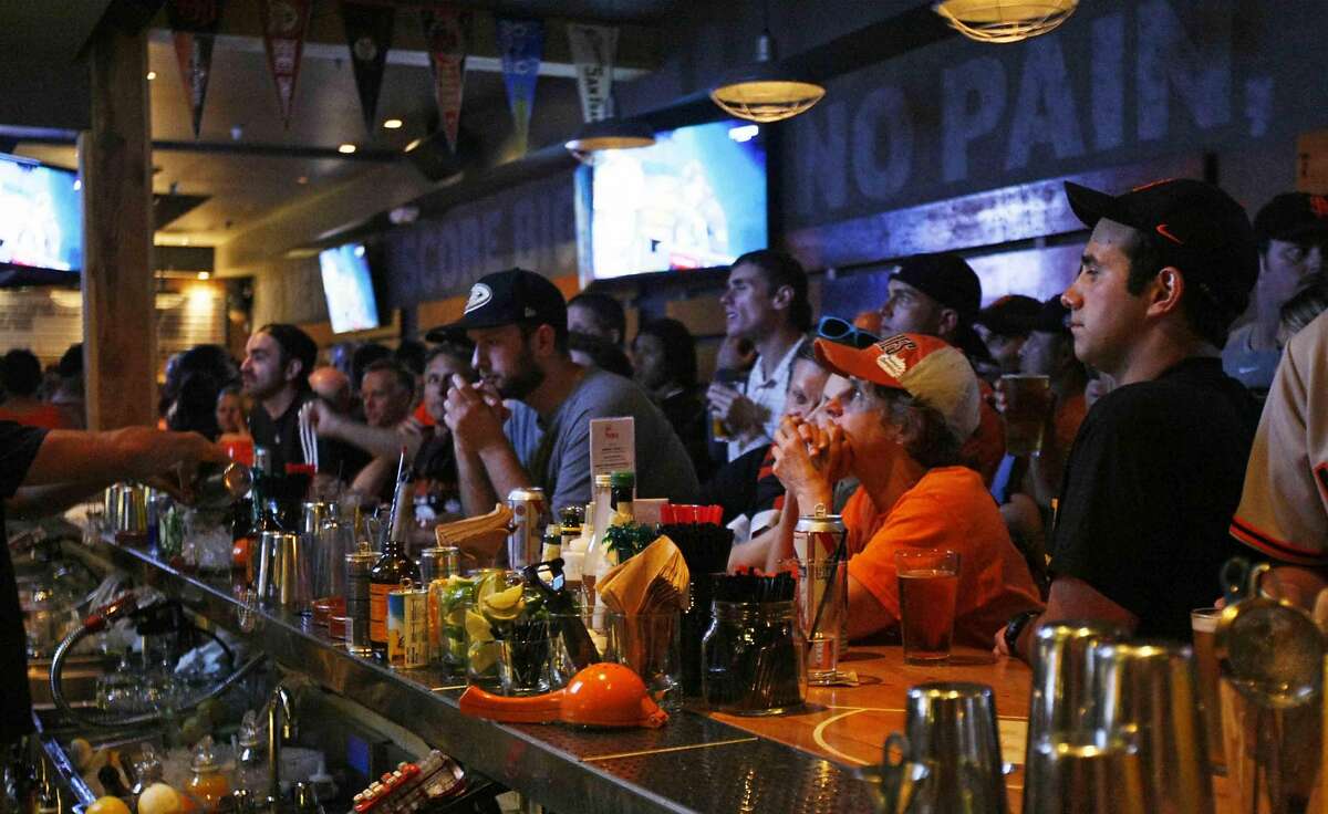 Hundreds of fans packed into Hi Tops bar in the Castro district of San Francisco, Calif. to watch the San Francisco Giants take on the Kansas City Royals in game 7 of the World Series Wednesday, October 29 2014.