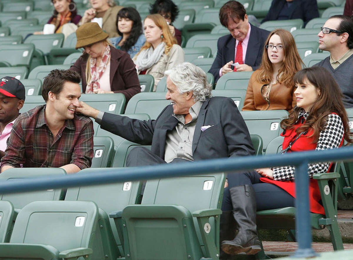 This 2012 image released by Fox shows, from left, Jake Johnson, Dennis Farina, and Zooey Deschanel in a scene from "New Girl." Farina died suddenly on Monday, July 22, 2013, in Scottsdale, AZriz., after suffering a blood clot in his lung. He was 69. (AP Photo/Fox, Greg Gayne)