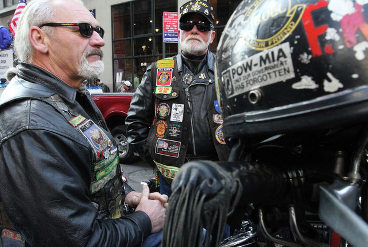 Vietnam War veterans Fred Reiman, of Norwood, N.J., left, and Rick Frato, of Township of Washington, N.J., wait to take part in the Veterans Day Parade Sunday Nov. 11, 2012 in New York. Both Rieman and Frato are with the Nam Knights. (AP Photo/Tina Fineberg)