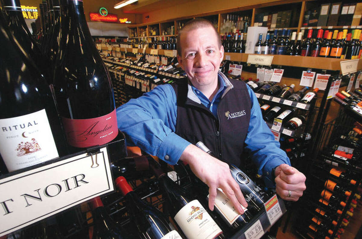Photo/Alex von Kleydorff. Mitch Ancona, Owner of Ancona's Wines and Liquors near the Pinot Noir's in his Ridgefield Store.