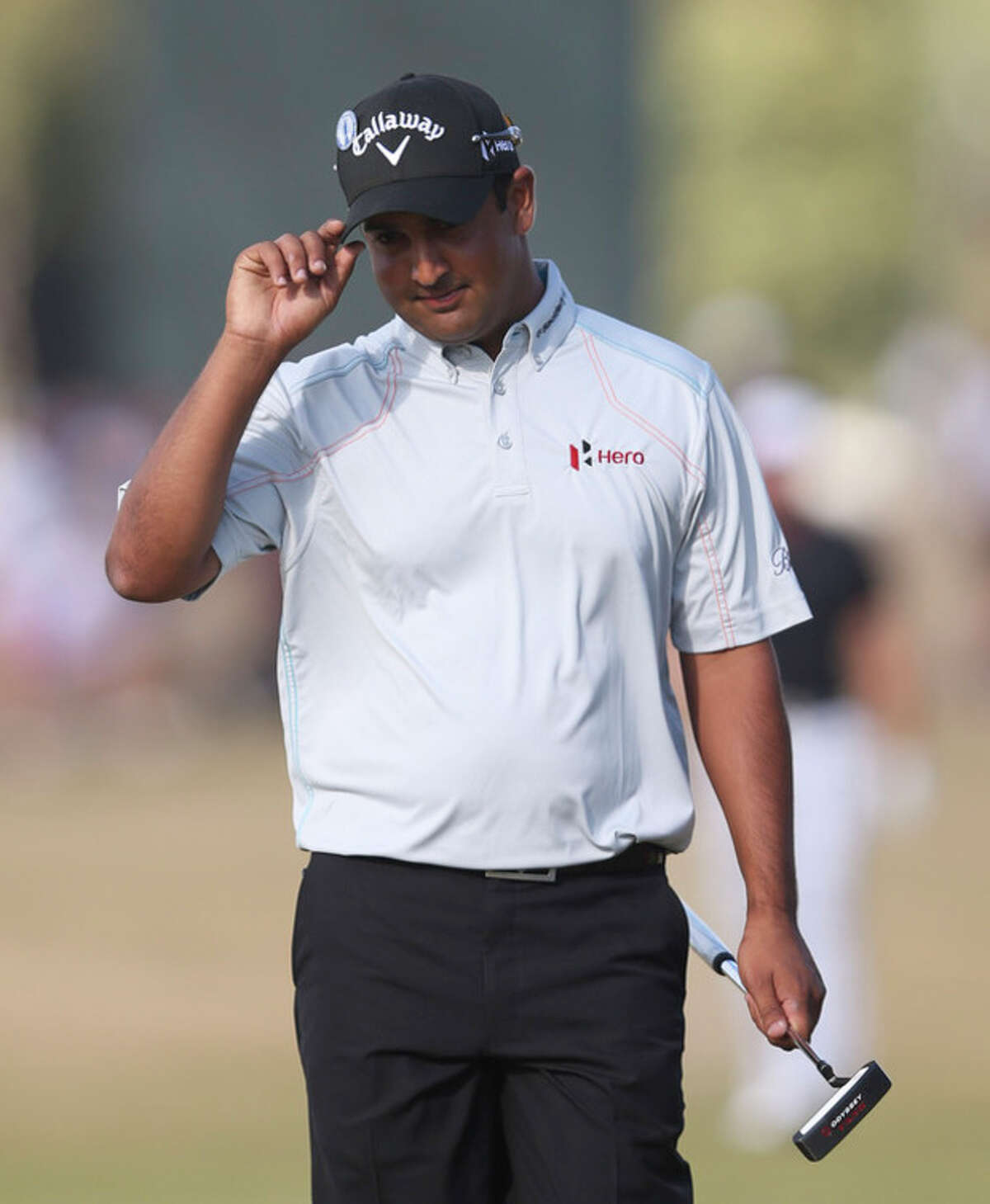 Shiv Kapur of India reacts after putting on the 9th green during the first round of the British Open Golf Championship at Muirfield, Scotland, Thursday July 18, 2013. (AP Photo/Scott Heppell)