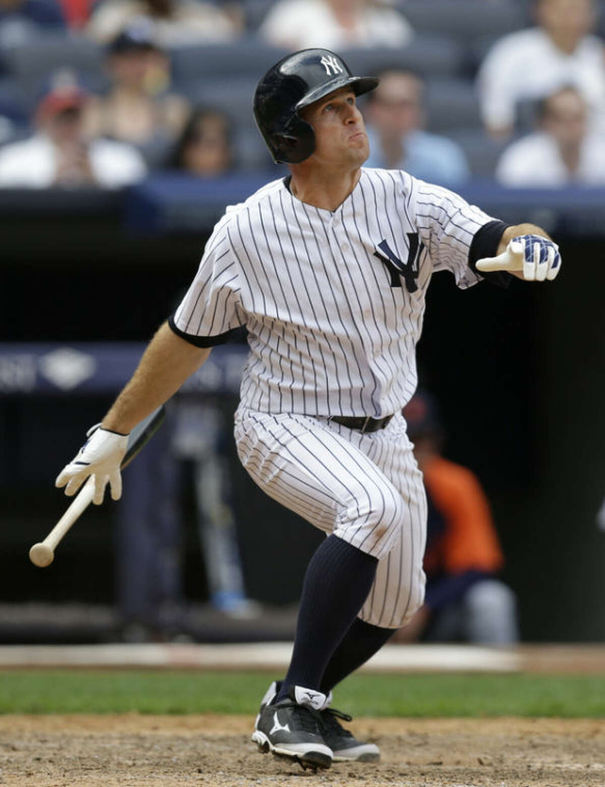 New York Yankees' Brett Gardner watches his ninth-inning solo home run off Detroit Tigers relief pitcher Jose Veras in a baseball game on Sunday, Aug. 11, 2013, in New York. The Yankees won 5-4. (AP Photo/Kathy Willens)