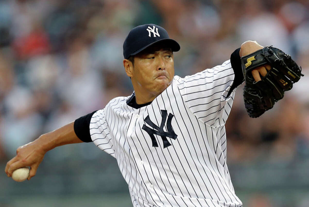 New York Yankees starting pitcher Hiroki Kuroda delivers in the first inning of a baseball game against the Los Angeles Angels, Monday, Aug. 12, 2013, in New York. (AP Photo/Kathy Willens)