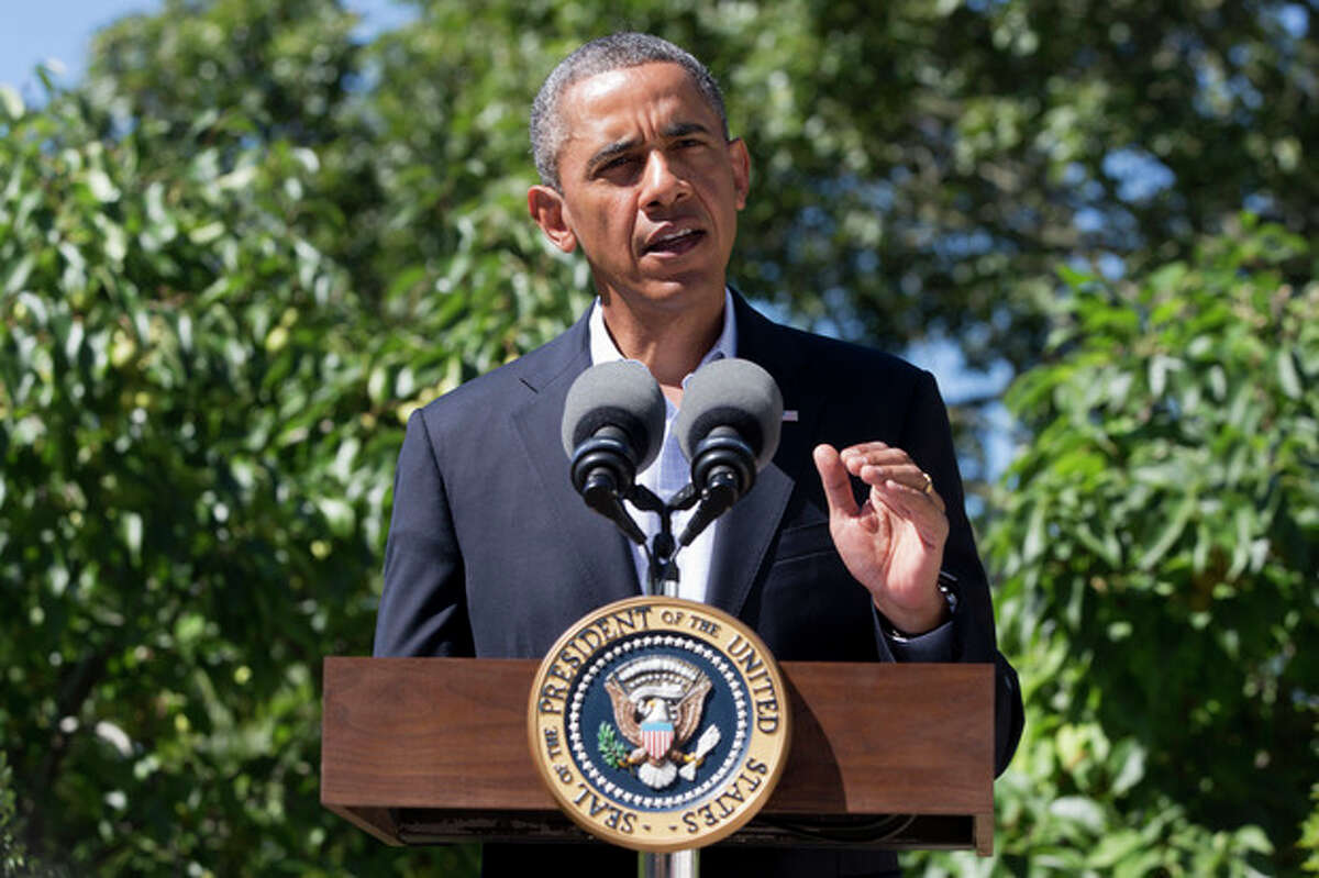 President Barack Obama makes a statement to the media regarding events in Egypt, from his rental vacation home in Chilmark Mass., on the island of Martha's Vineyard, Thursday, Aug. 15, 2013. The president announced that the US is canceling joint military exercise with Egypt amid violence. (AP Photo/Jacquelyn Martin)