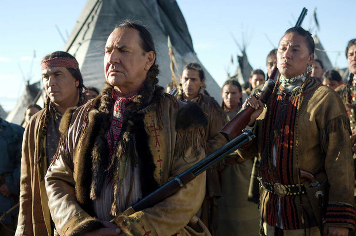 FILE - This undated file photo supplied by HBO shows actors Eric Schweig, left, August Schellenberg and Nathan Chasing Horse, right, in the HBO film "Bury My Heart at Wounded Knee." Schellenberg, who starred in the ?“Free Willy?” films and appeared in numerous television roles, has died at his Dallas home after a fight with lung cancer, his agent said Friday. He was 77. (AP Photo/HBO, Annabel Reyes, File)