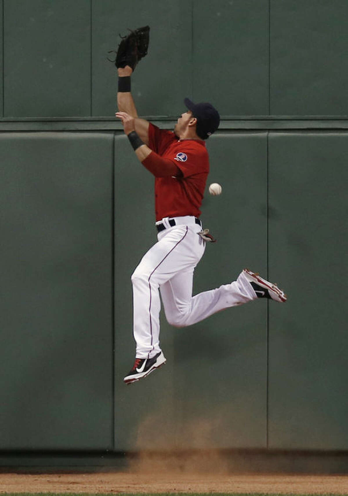 Boston Red Sox center fielder Jacoby Ellsbury can't catch a triple by New York Yankees' Eduardo Nunez during the fourth inning of a baseball game at Fenway Park in Boston Friday, Aug. 16, 2013. (AP Photo/Winslow Townson)