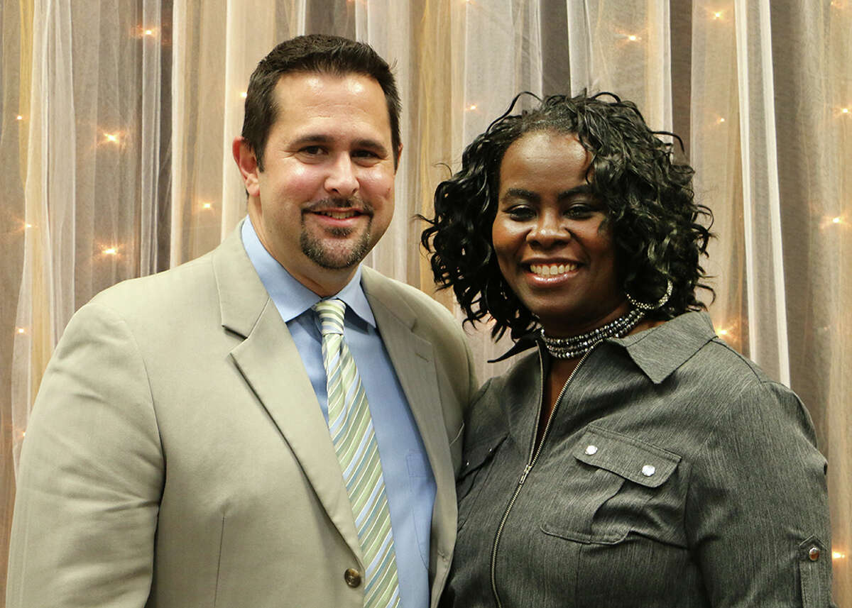 Pearland Independent School District 2016 principals of the year Jason Frerking, left, and Verna Tipton celebrate at the district's annual service awards celebration.