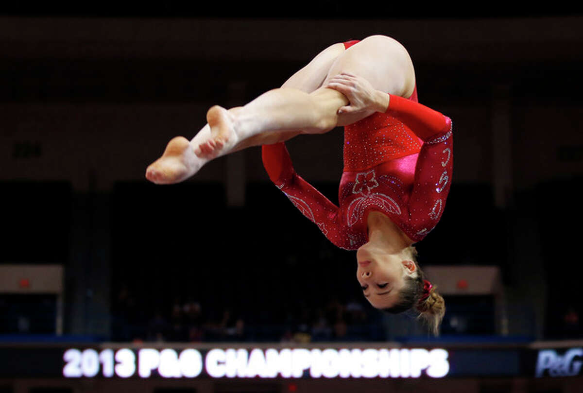 McKayla Maroney competes on the floor exercise during the U.S. women's national gymnastics championships in Hartford, Conn., Saturday, Aug. 17, 2013. (AP Photo/Elise Amendola)