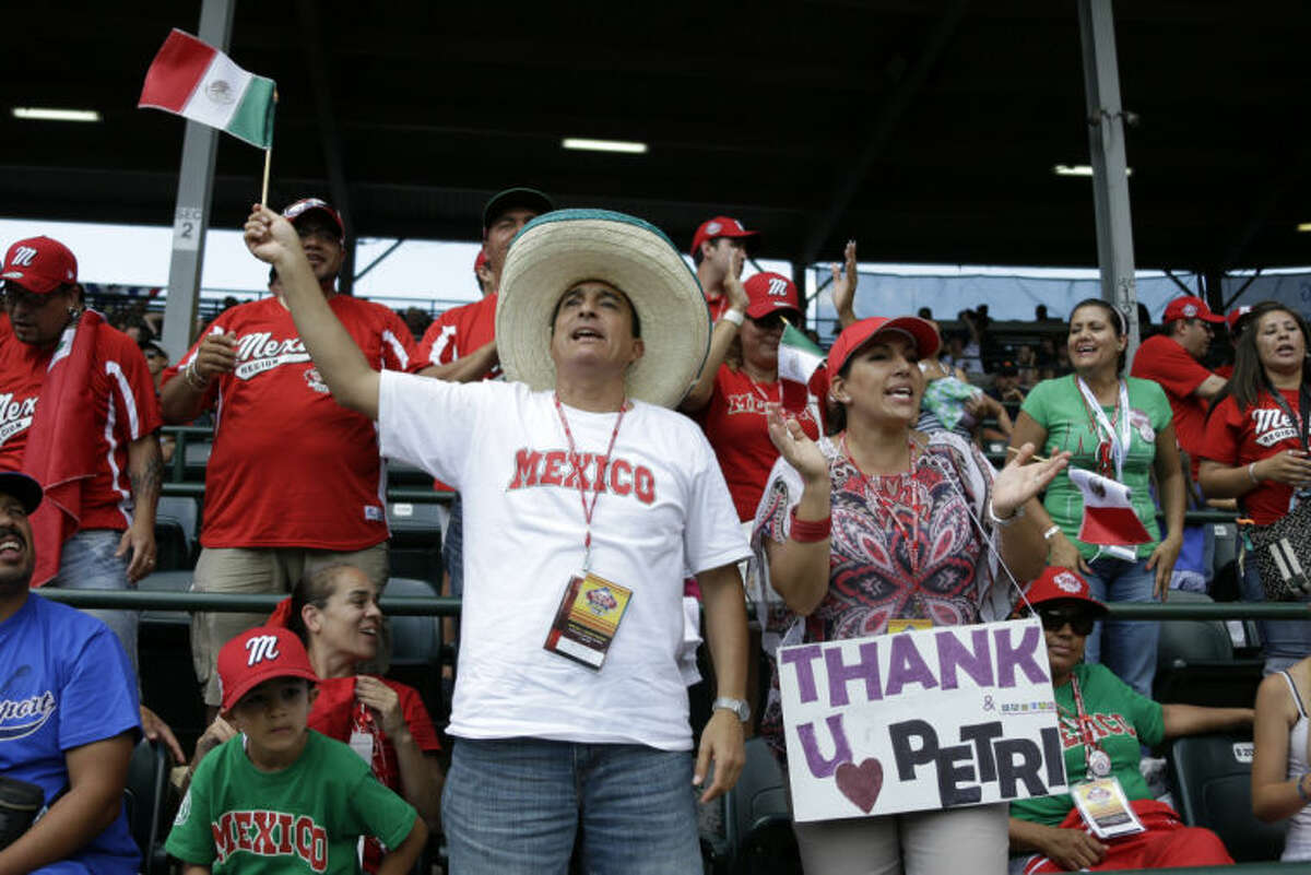 Tijuana, Mexico, Little League parents and fans celebrate after the final out of a 15-14 win over Westport, Conn., in a consolation baseball game at the Little League World Series tournament in South Williamsport, Pa., Sunday, Aug, 25, 2013. (AP Photo/Gene J. Puskar)