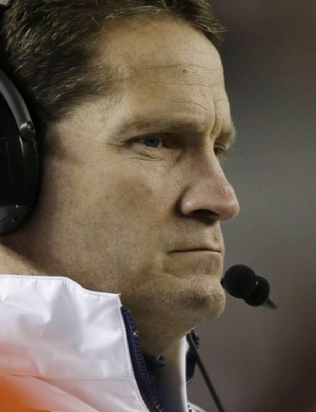 Auburn coach Gene Chizik watches the game near the end of a 49-0 loss to Alabama during the second half of a NCAA college football game at Bryant-Denny Stadium in Tuscaloosa, Ala., Saturday, Nov. 24, 2012. (AP Photo/Dave Martin)