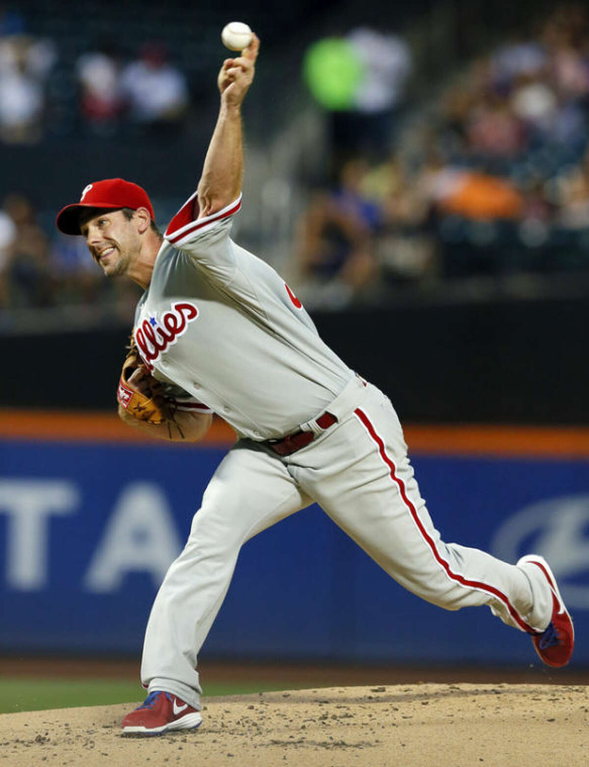 Philadelphia Phillies starting pitcher Cliff Lee (33) throws in the first inning of a baseball game against the New York Mets at Citi Field, Monday, Aug. 26, 2013, in New York. (AP Photo/Paul J. Bereswill)
