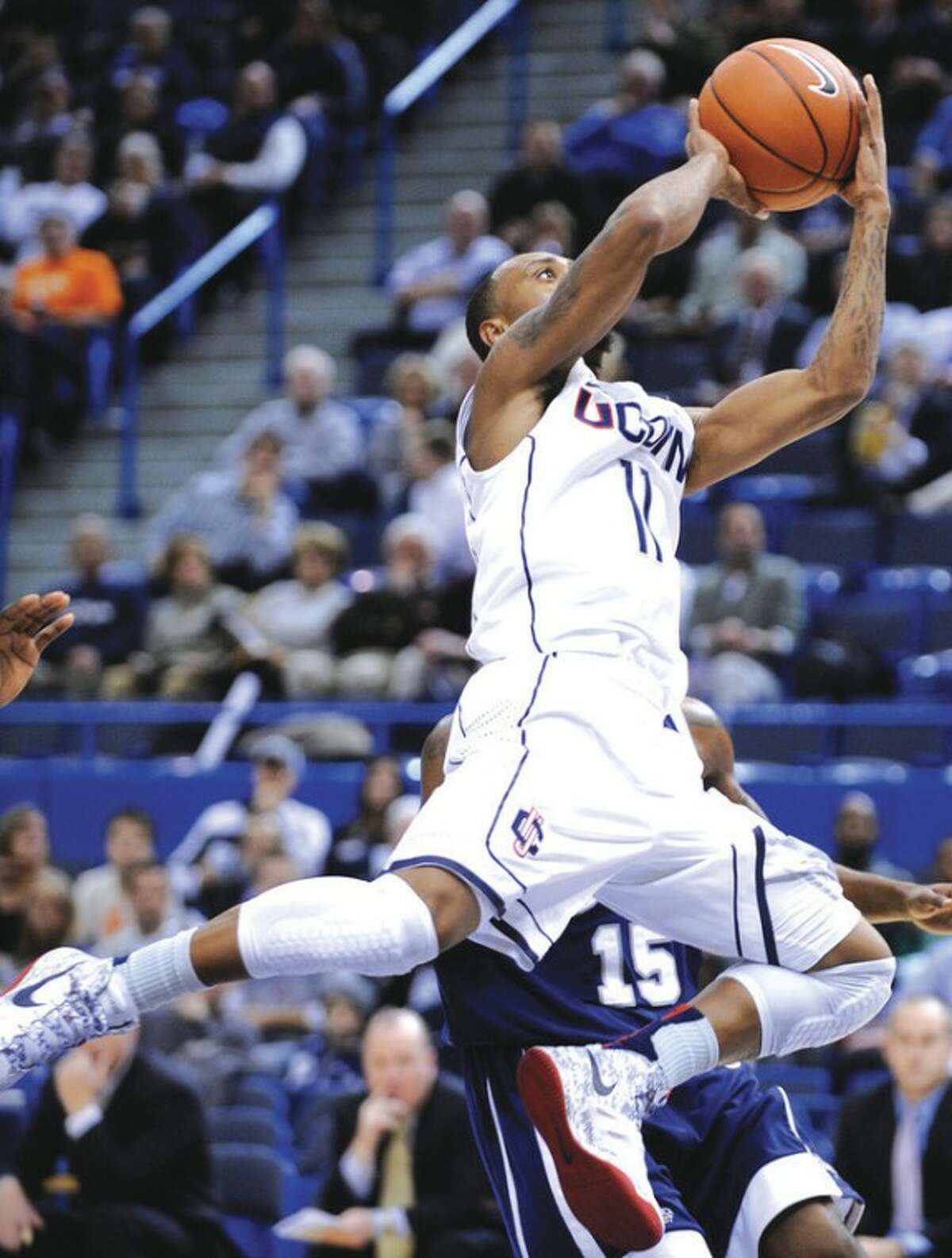 AP photo UConn's Ryan Boatright drives during Thursday's game against New Hampshire. UConn scored a 61-53 victory.