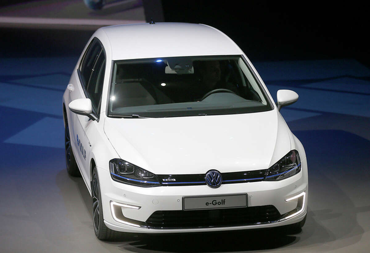 The new Volkswagen e-Golf displayed during a preview by the Volkswagen Group prior to the 65th Frankfurt Auto Show in Frankfurt, Germany, Monday, Sept. 9, 2013. More than 1,000 exhibitors will show their products to the public from Sept. 12 through Sept. 22, 2013. (AP Photo/Frank Augstein)